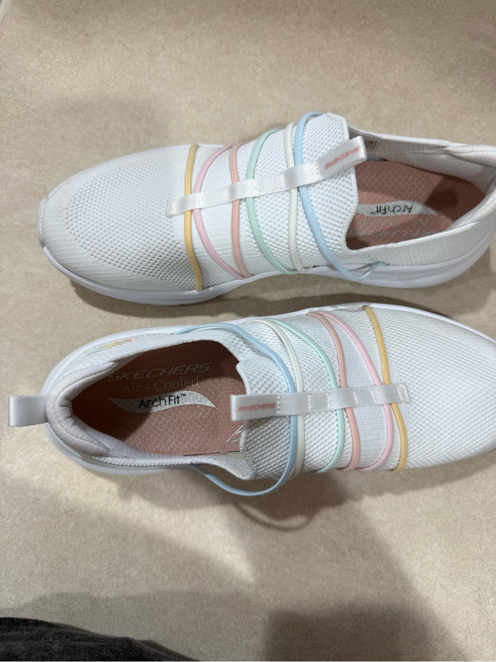 Skechers White Slip-On Sneakers with Pastel Rainbow Bands